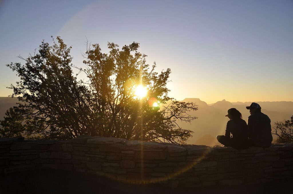 Two people watching the sunrise together
