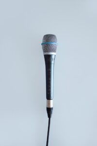 black and gray corded microphone
