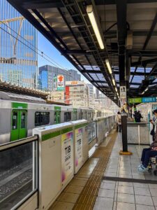 a subway station with people waiting for the train