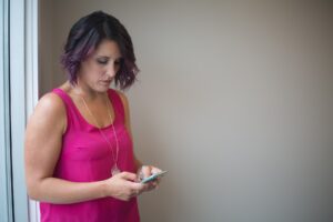 A person typing a message on a smartphone