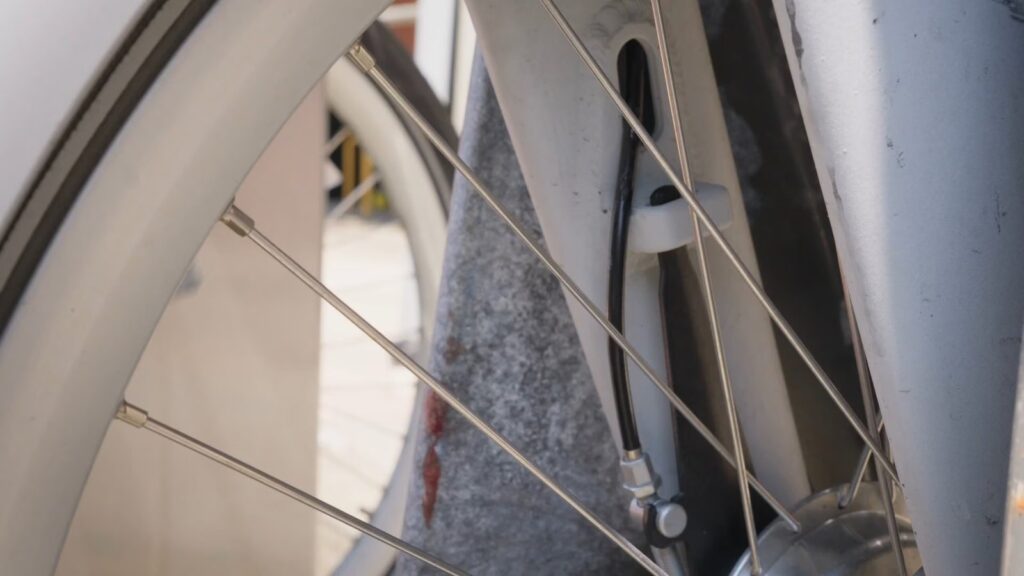 A 3D-printed device mounted on the front fork of a Citi Bike